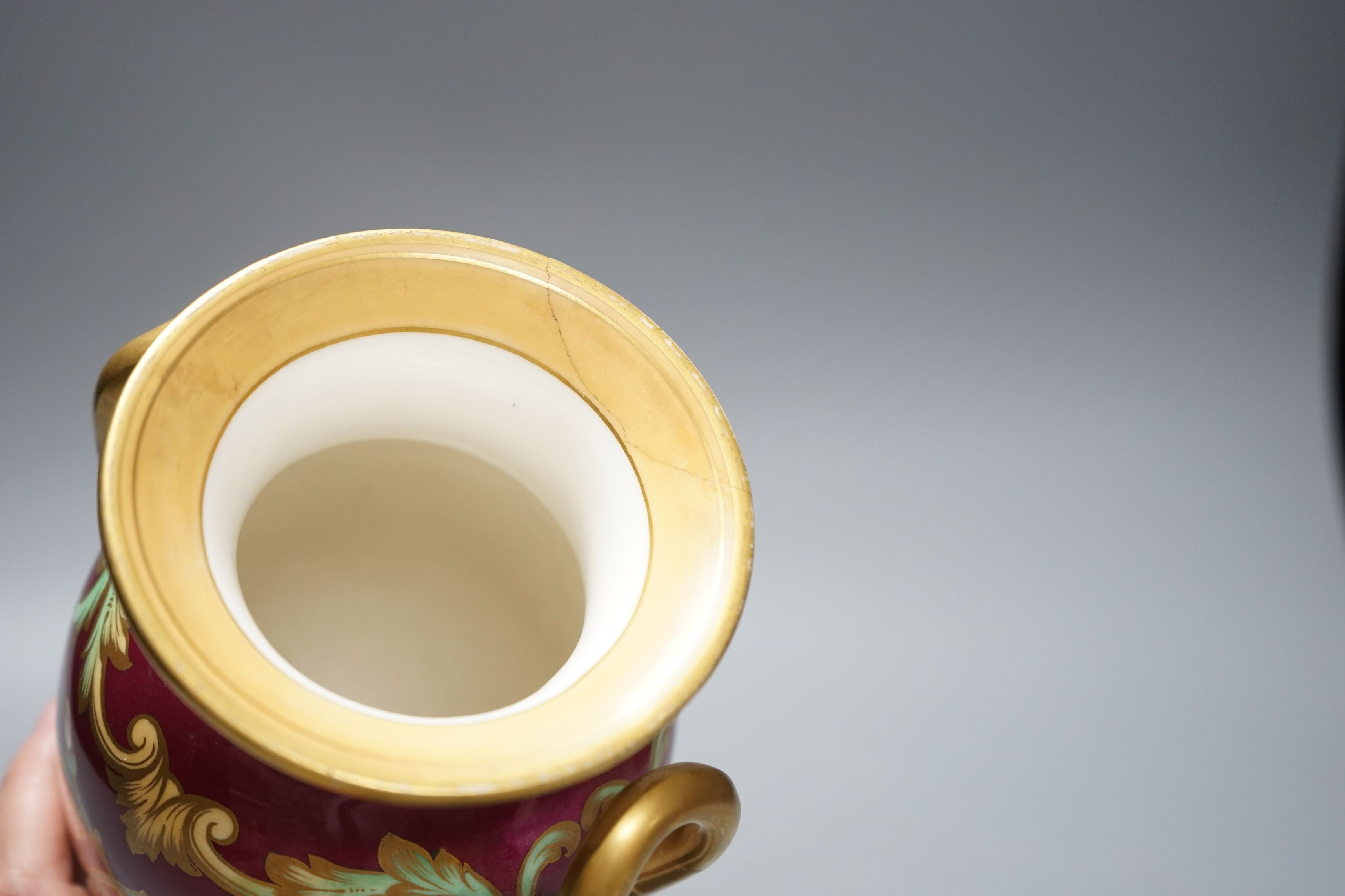 A 19th century English bone china two handled vase, decorated with a central cartouche, in distinctly signed on base, 21.5cms high